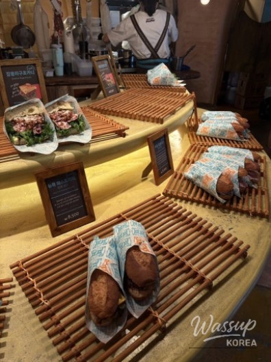 Bread display shelves showcasing a variety of baked goods