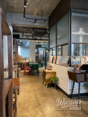 Fresh cream red bean bun served with iced Americano on a wooden table