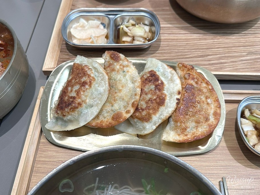 Detail shot showing the clarity of chilled Pyongyang cold noodle broth