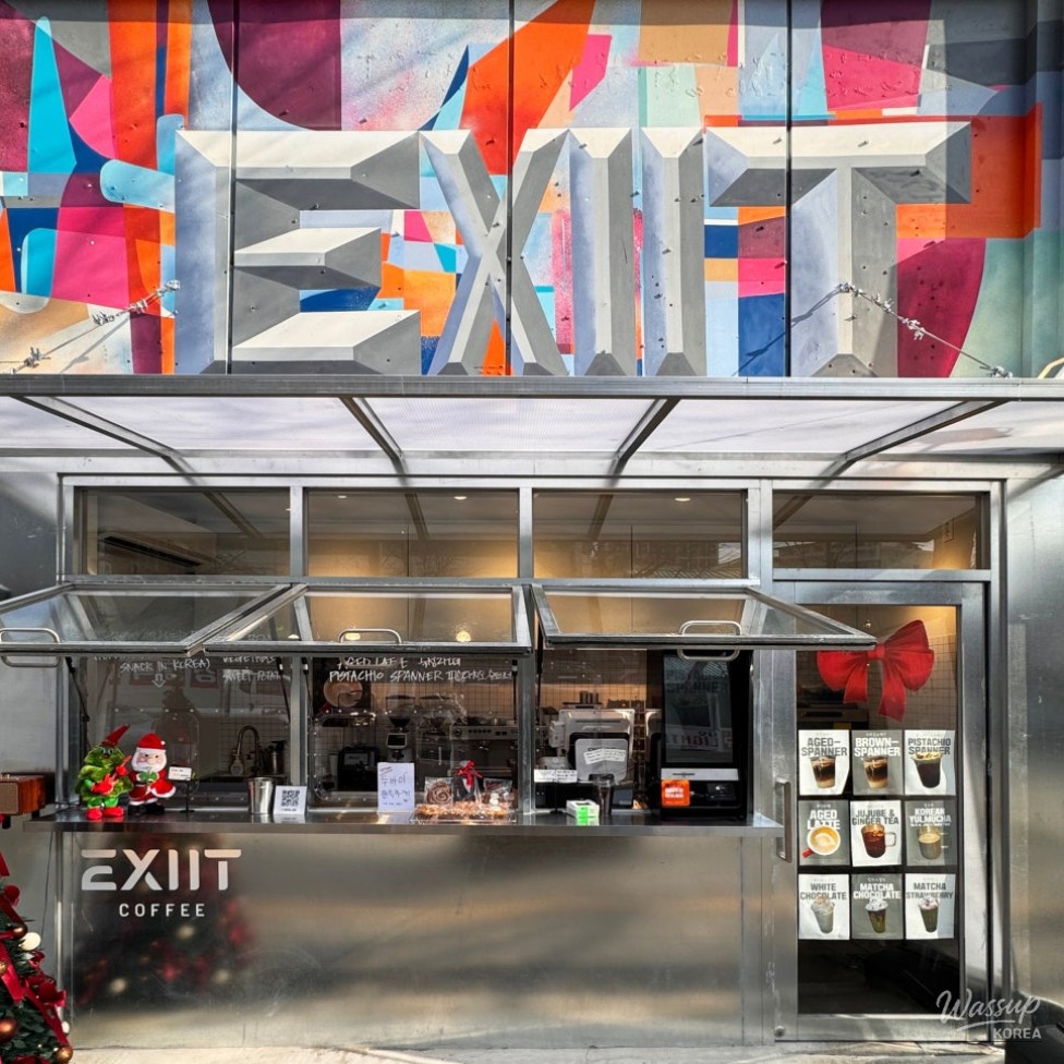 Takeout cup design featuring Exit Cafe branding and graphic patterns