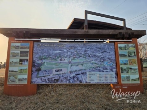 Stone tablets displayed along walking paths at Seongju Historical Theme Park
