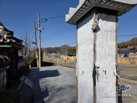 Close-up view of historical plaque preserved inside the sacrificial gate