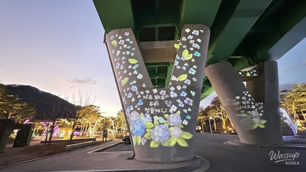 Winter night scenery at Goeun Light Park with illuminated paths and calm river reflections