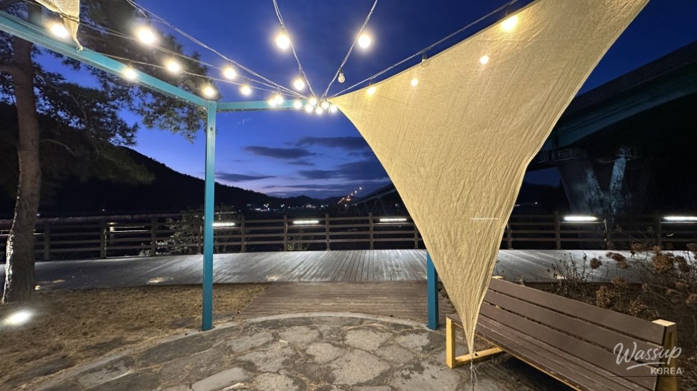 Wide night walking path along the river at Goeun Light Park