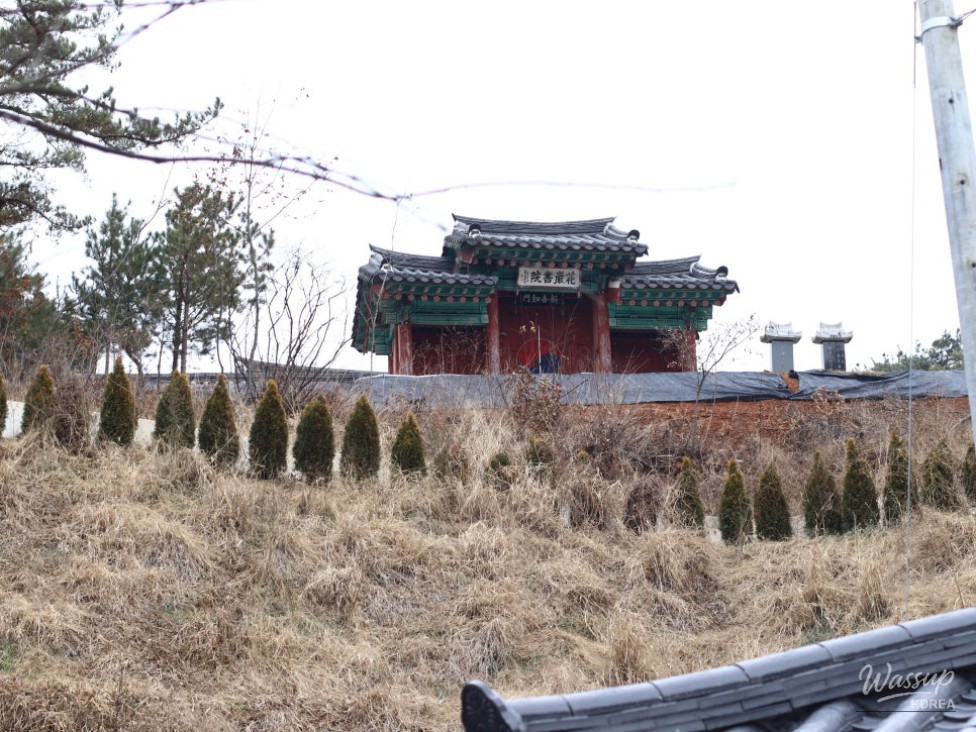 Wooden deck stairs leading up to the seowon from the park