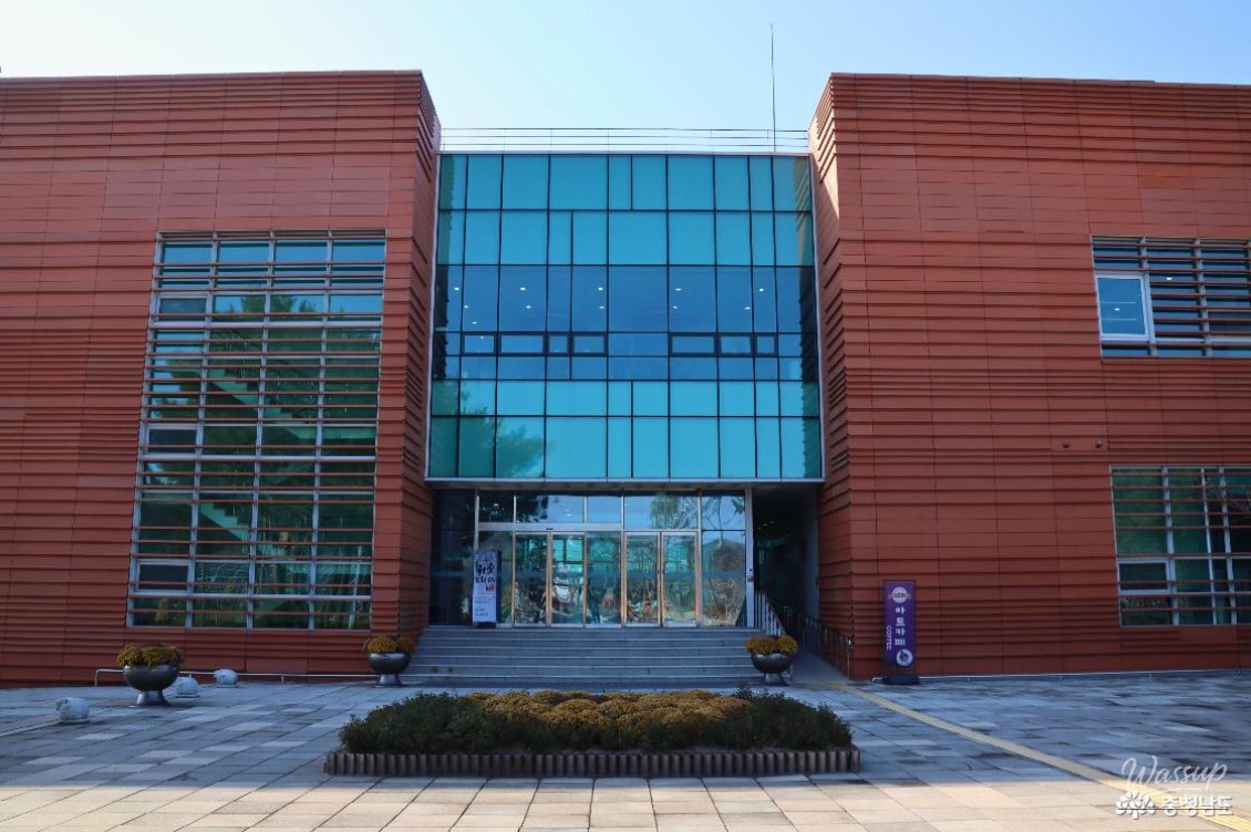 Close up shot of delicate fabric art showing watercolor textures and floral motifs