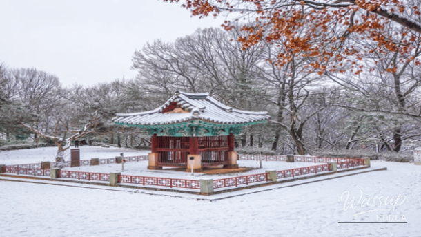 Red brick Jeondong Catholic Church standing majestically amidst winter snow