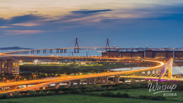 Bright neon lights of amusement park rides at Wolmido at night