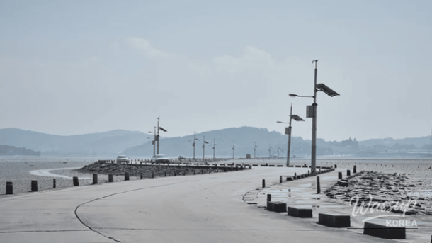 Sunset reflecting over the parted sea road at Jebudo Island