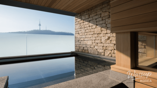 Stylish rooftop bar and poolside lounge area with modern lighting for a romantic winter night