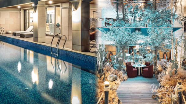 A luxurious rooftop heated pool with a stunning night view of the city skyline during winter