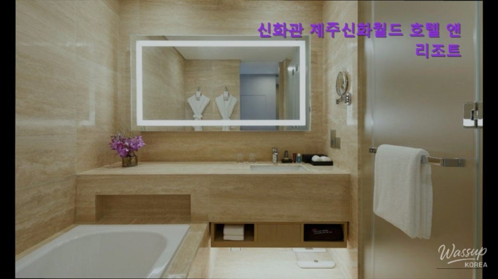 Night view of the Shinhwa Theme Park entrance with vibrant festival lights