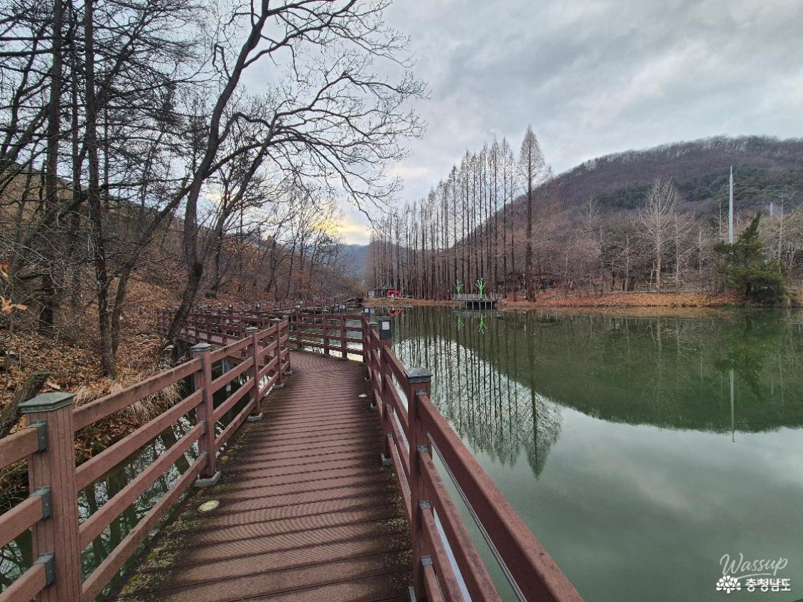 A scenic view of the pavilion and benches at the waterfront park during winter
