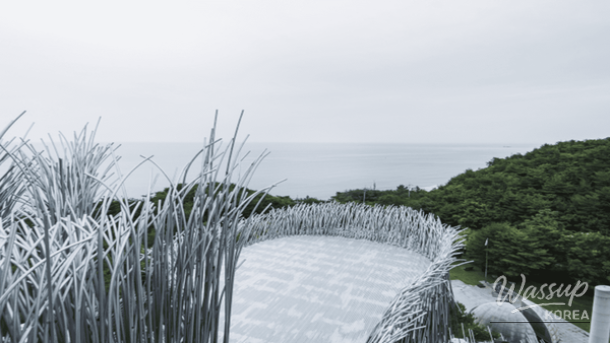 Quiet winter waves at Gangmun Beach with white sand and clear blue water
