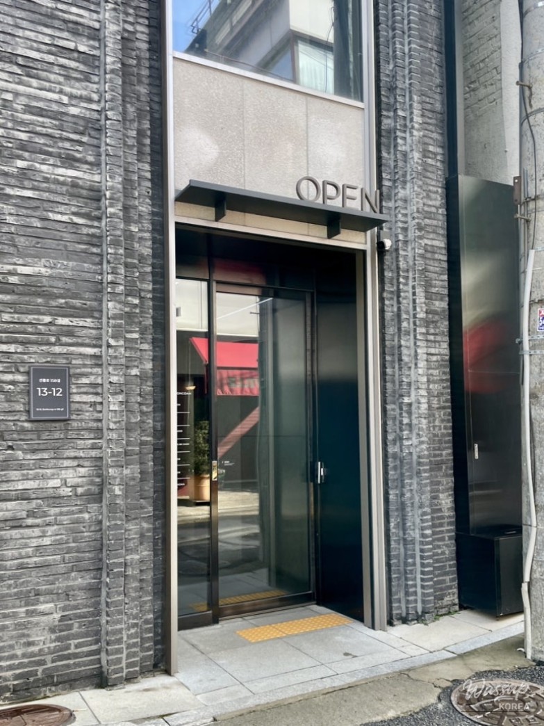 Exquisite contemporary dish plating at Myungbodang featuring artistic garnishes