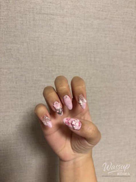 A variety of nail art supplies and 3D gels