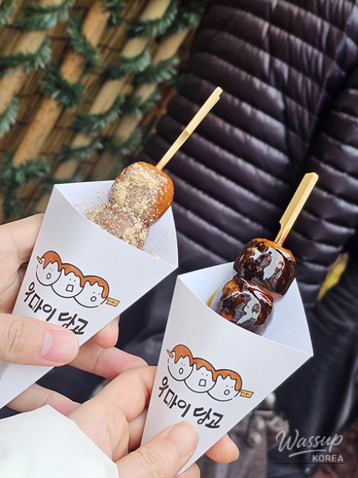 Premium beef cuts including beef tongue being grilled on a charcoal fire