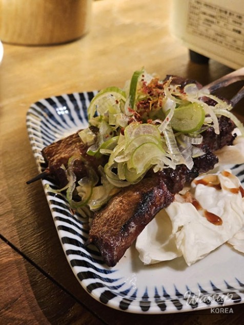 A close-up of the ramen broth and noodles
