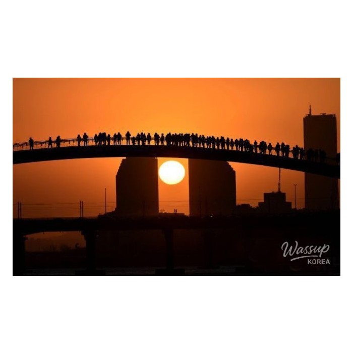 A breathtaking sunrise view over the Seoul skyline and Han River from a mountain peak