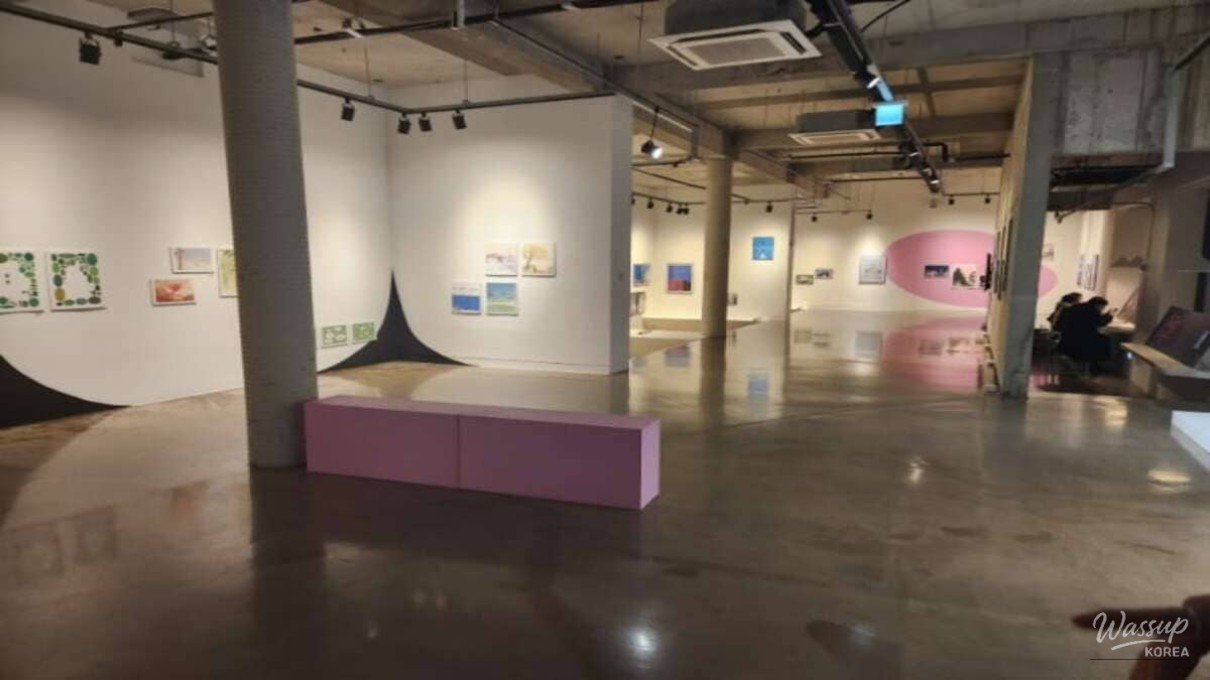 A unique outdoor art space featuring the rough concrete walls of the repurposed Soda Museum in Hwaseong