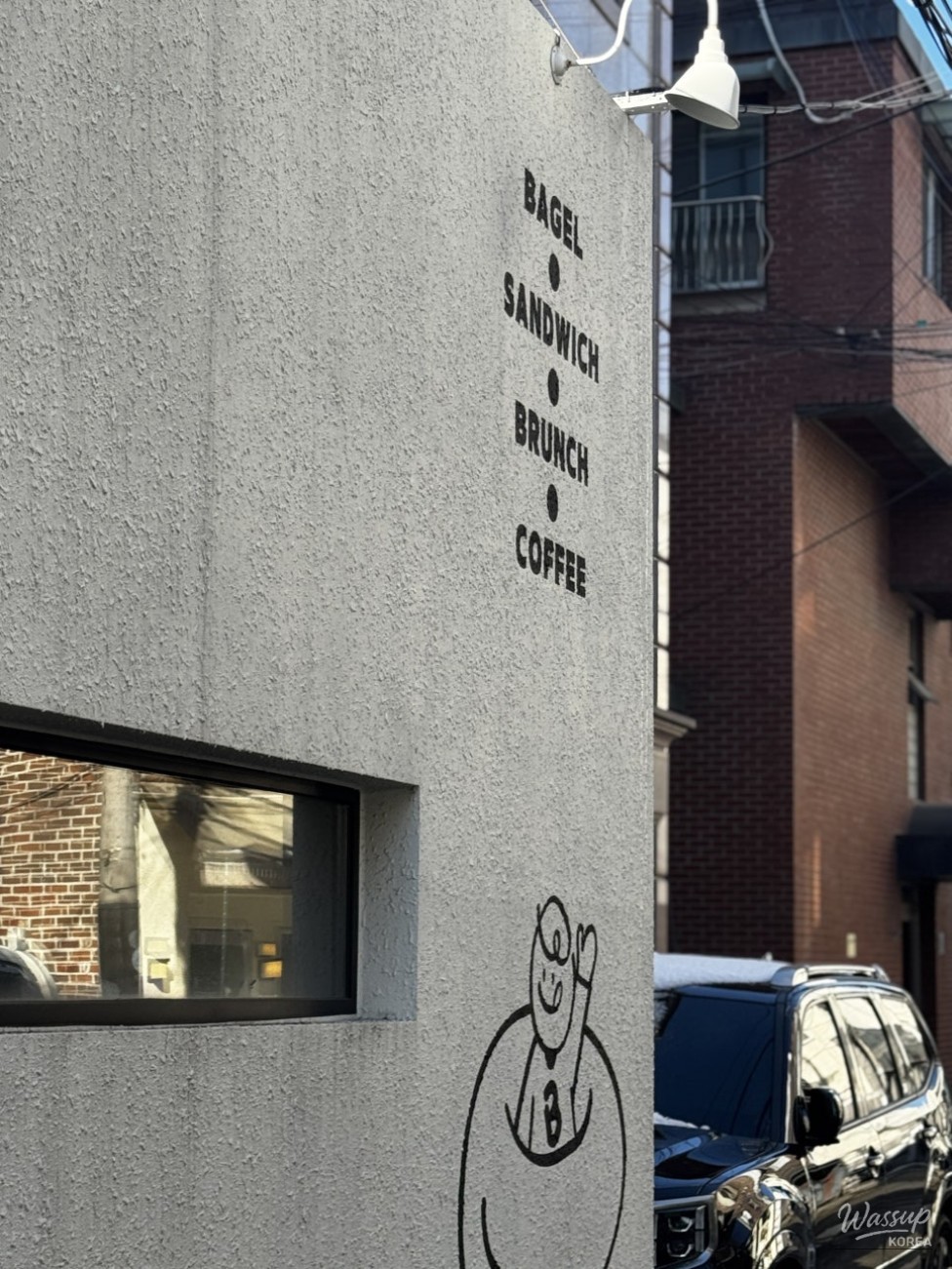 Atmospheric exterior of Bake Garden café near Isu Station featuring a cozy alleyway vibe