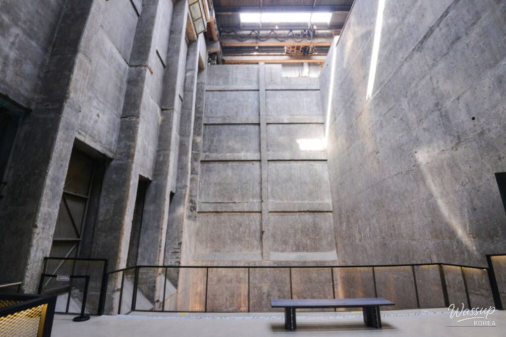 Rough concrete walls and industrial machinery preserved inside the former incineration plant