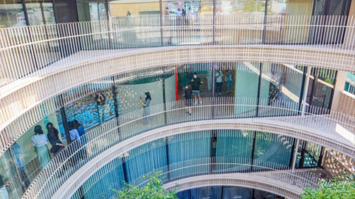 Low angle view of the iconic red brick circular architecture of Ground Seesaw Seochon against the blue sky