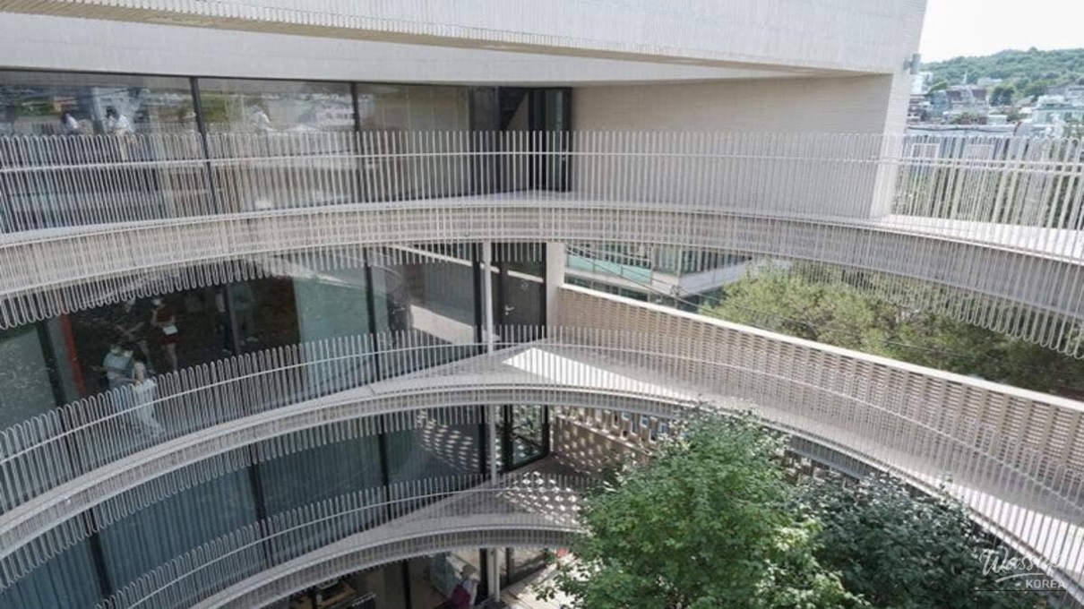 A view of the Seochon neighborhood rooftops through the architectural frames of Ground Seesaw