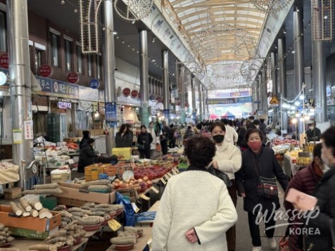 Various traditional Korean groceries and local side dishes displayed at a market stall