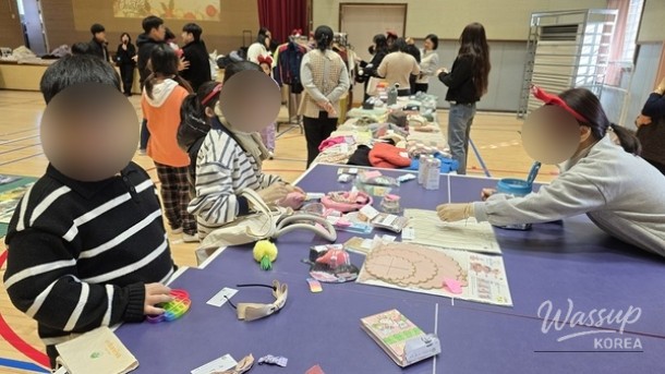 A collection of pre-loved items and books displayed for exchange at the school's winter festival market