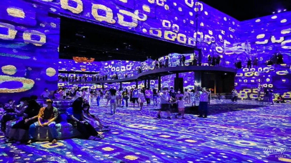 The central stage area of the media art hall showing a panoramic Egyptian landscape