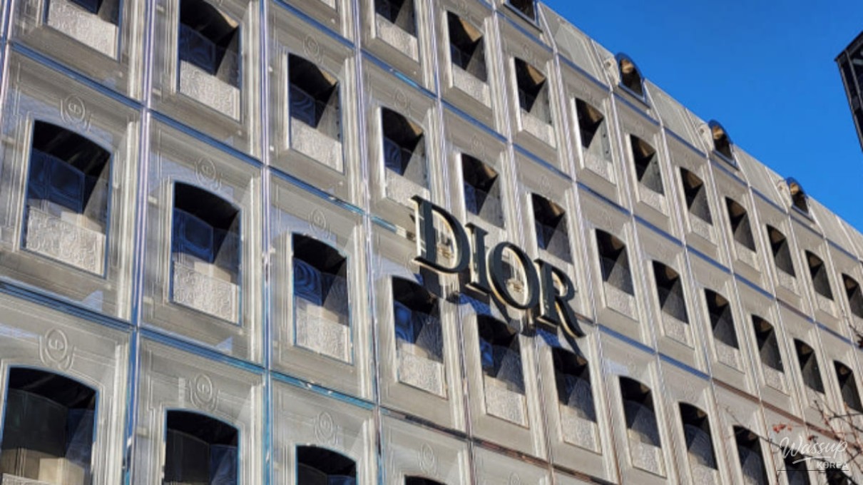 The stunning glass facade of Dior Seongsu reflecting the winter sky in Seoul