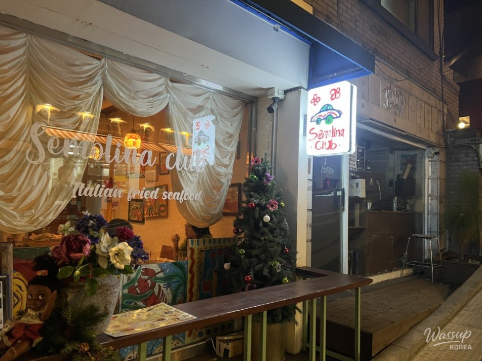 The warm and inviting exterior of Semolina Club in the alleys of Haebangchon