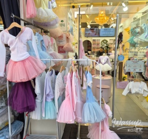 Storefront displaying various children's dancewear items