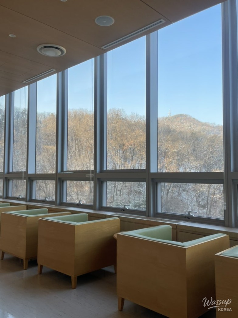 A beautifully decorated Christmas tree standing tall in a hospital lobby
