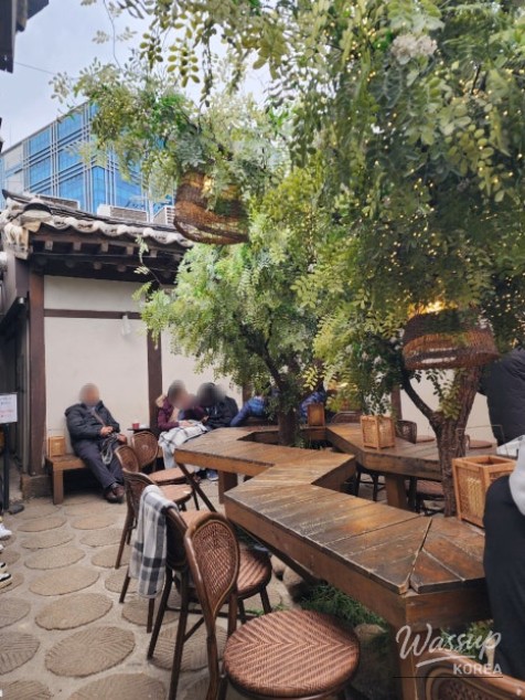 Hanok alley scenery with people posing for photos