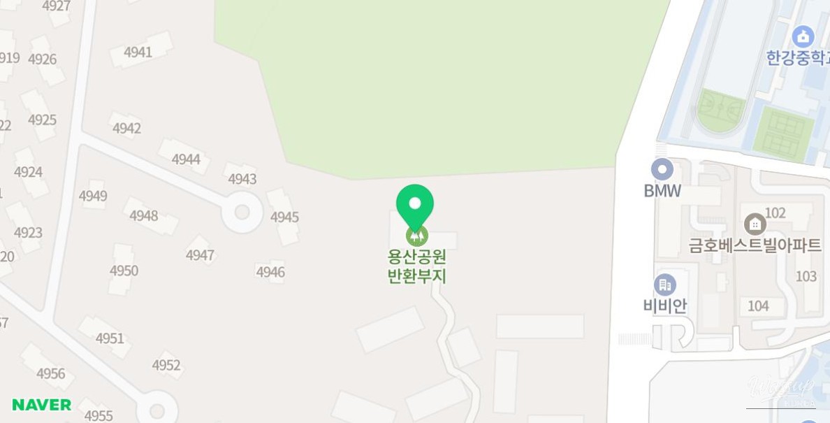 Path lined with red brick houses leading to Untitled Cafe