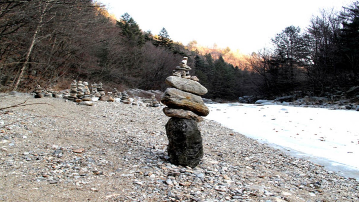 Seonjae-gil trail with frozen valley and calm winter forest scenery