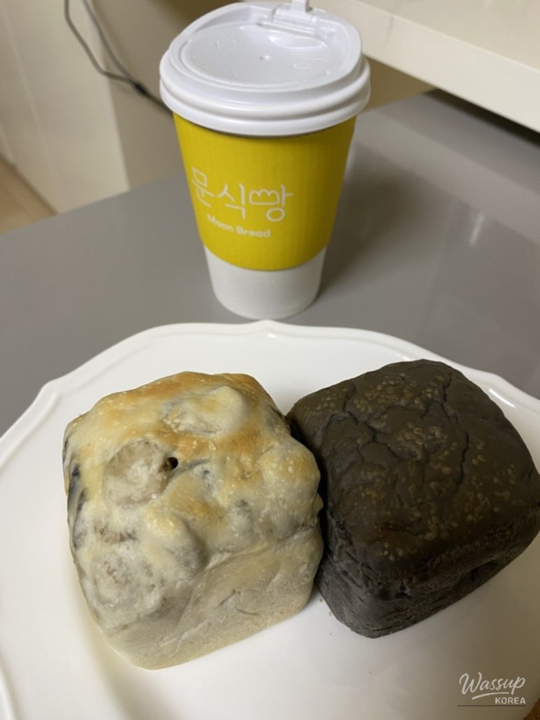 Aglio Olio cube bread sliced open showing olives and cheese