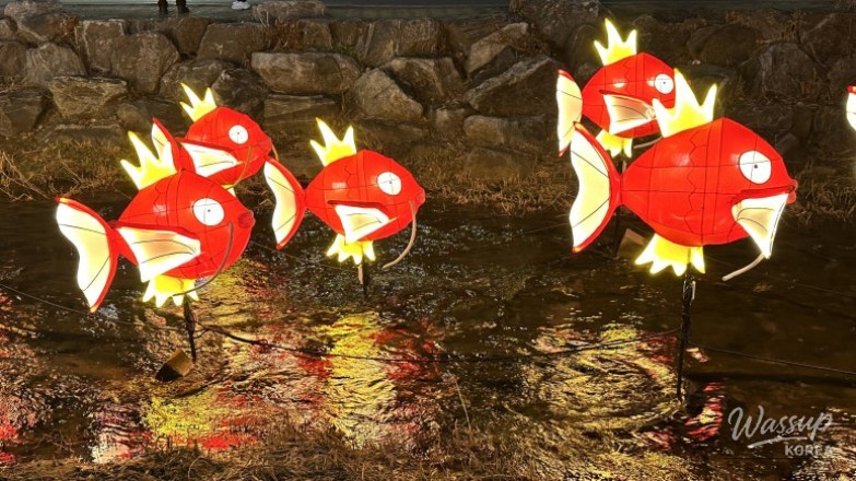 Colorful King Carp installations along Cheonggyecheon at night in winter