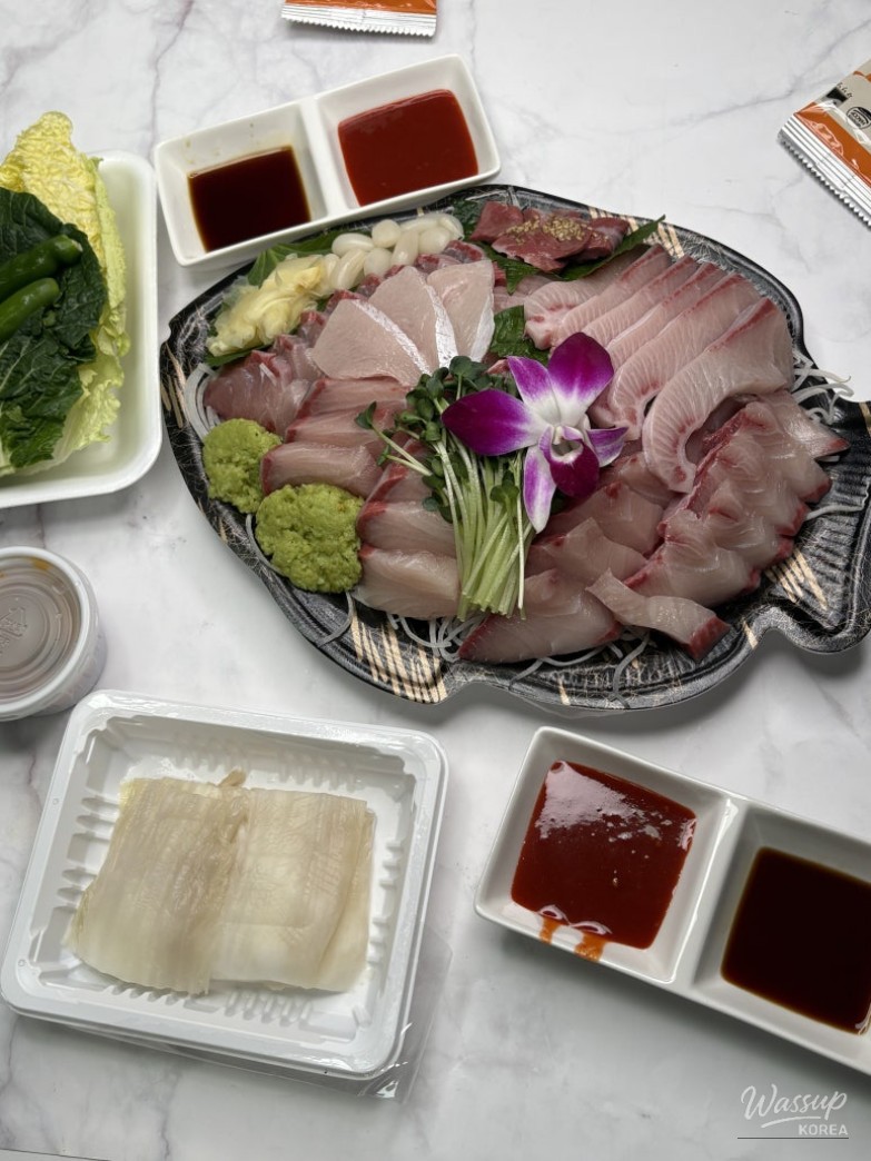 Neatly prepared yellowtail sashimi showcasing fresh texture at Sea Nation