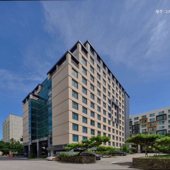 Exterior view of Jeju Grace Hotel in Seogwipo with a calm Jeju atmosphere
