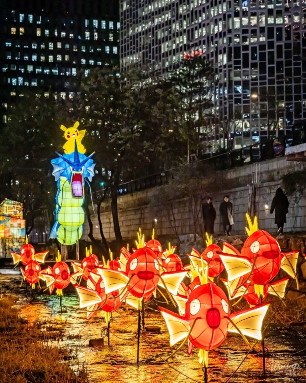Visitors walking along Cheonggyecheon enjoying the lantern festival at night