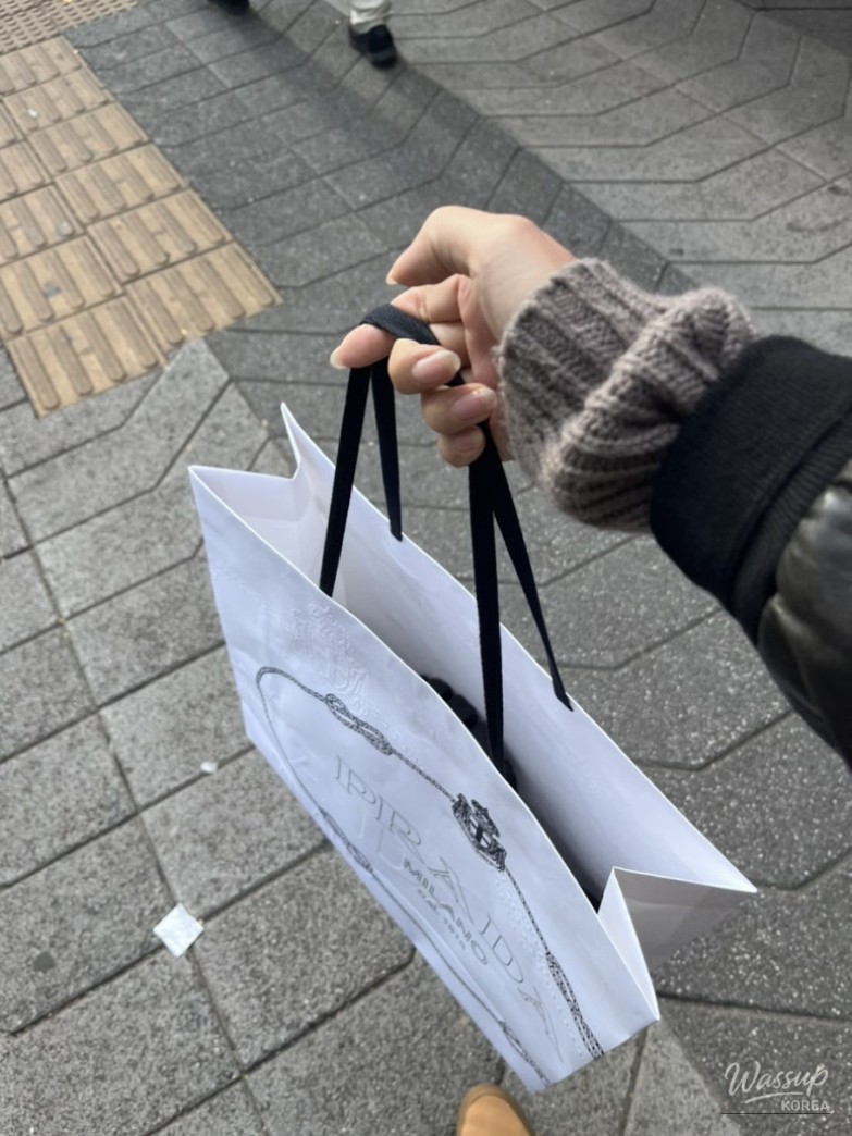 Side view of Prada Monolith loafers highlighting thick sole and leather finish