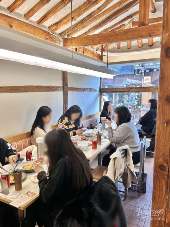 Cozy interior atmosphere of Ikseon Jabbang with wooden tones