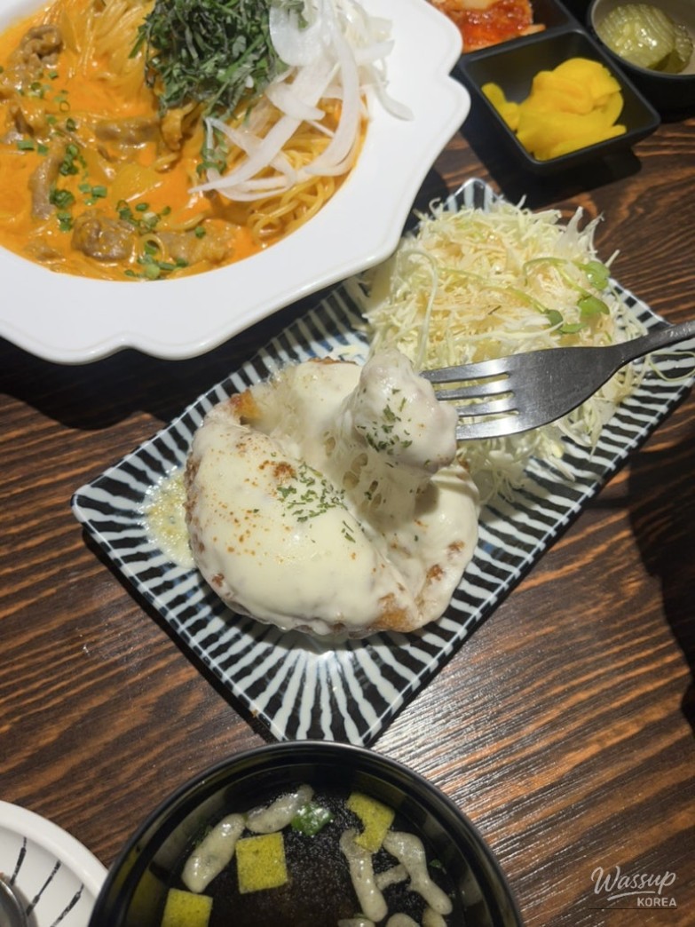 Dining table view with multiple dishes at Yeonnam Tomato Bukchon