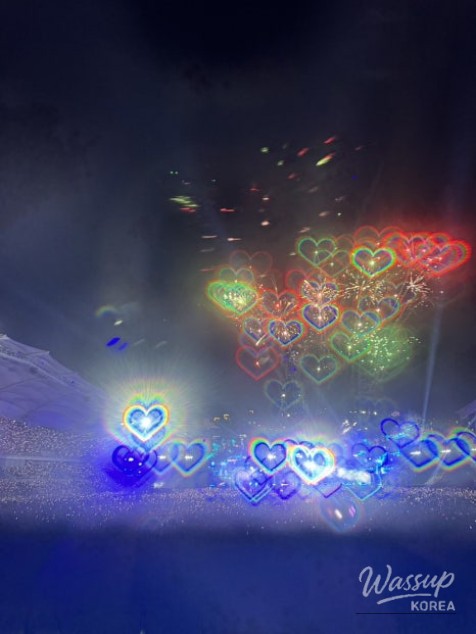 Outdoor festival view showing the picnic zone and stage area from the crowd