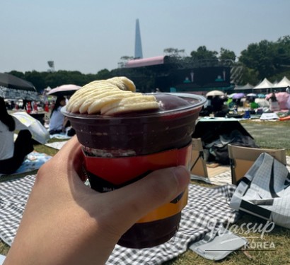 High-energy anniversary concert scene with the crowd closely packed near the stage