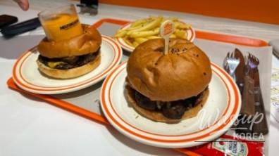 Side angle view of burger stack at Melting Soul