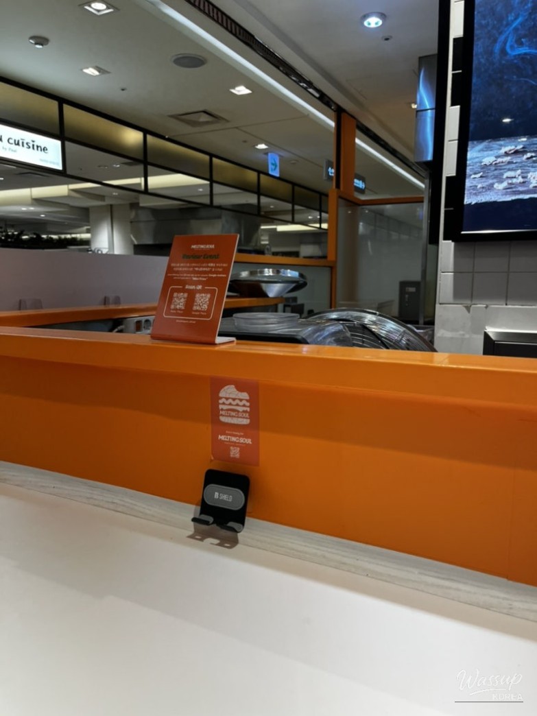 Close-up of burger patty and bun texture at Melting Soul